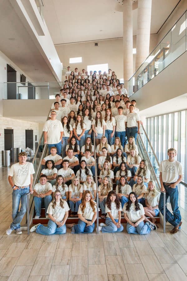 The 2026–27 Odessa Symphony Guild Belles and Beaux gathered on a staircase